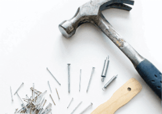 maintenance abstract hammer with nail