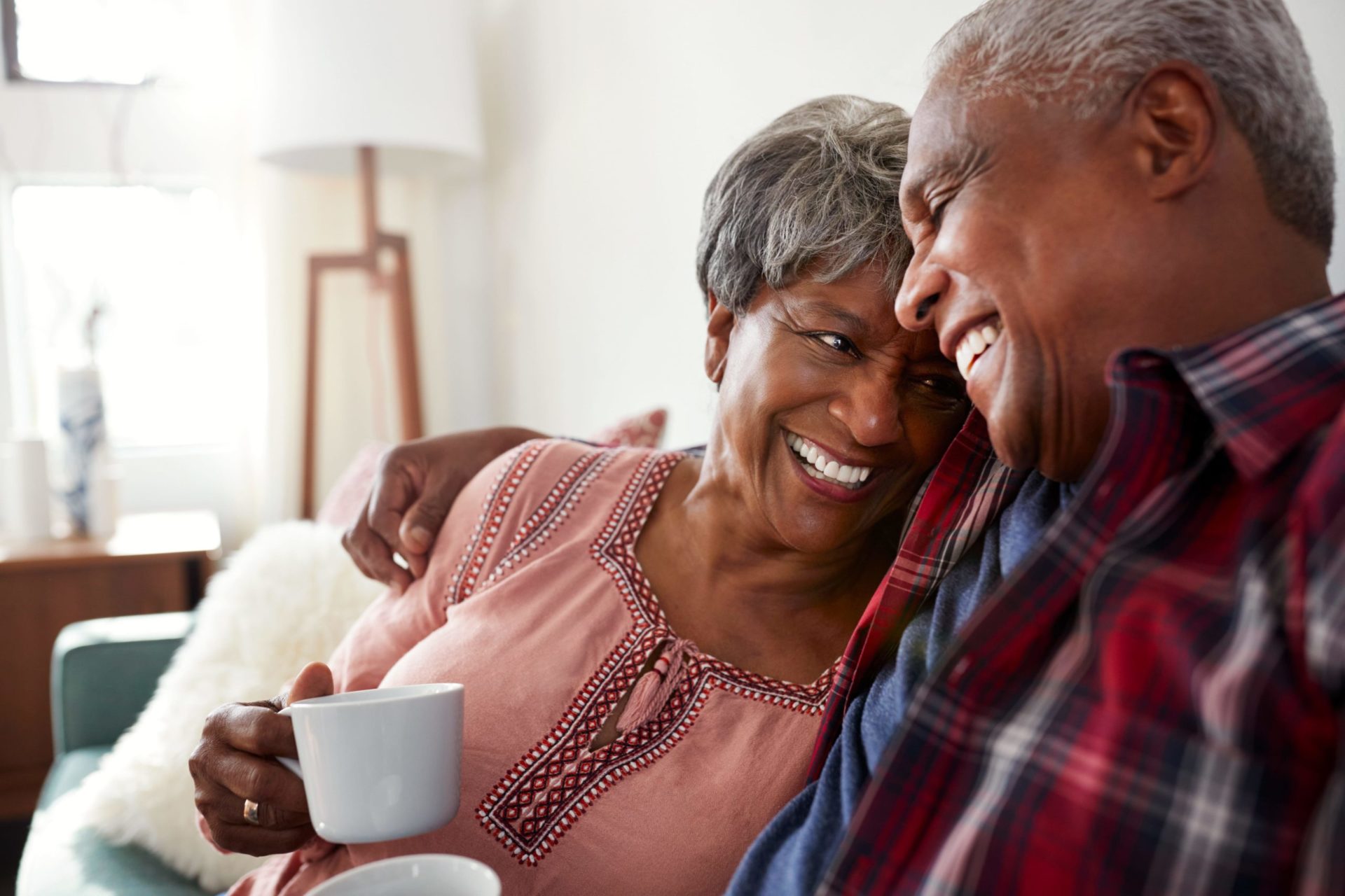 Old Couple cuddling and smiling